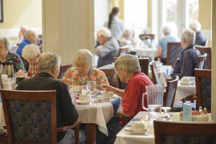 Seniors eating in dining room