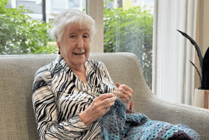 senior woman crocheting