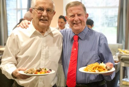 Two Senior Men Enjoying Dinner