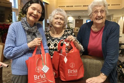 Seniors Displaying Gift Bags