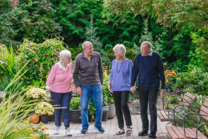 Four seniors walking at Sunridge Gardens