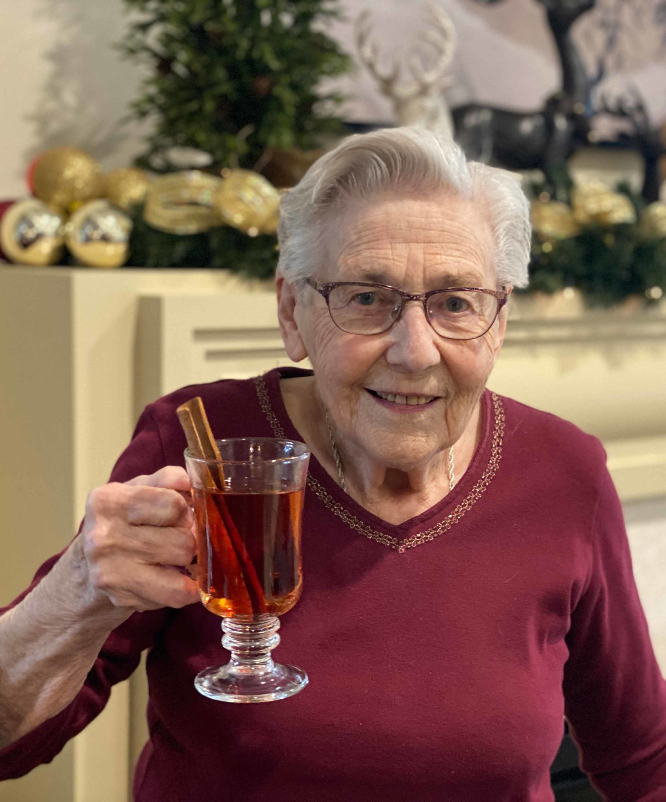 senior drinking hot cider