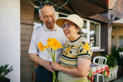 senior couple with flowers