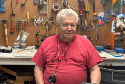 healthy senior volunteer in a retirement living community workshop