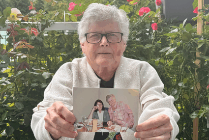 Vivien holding photo of penpal