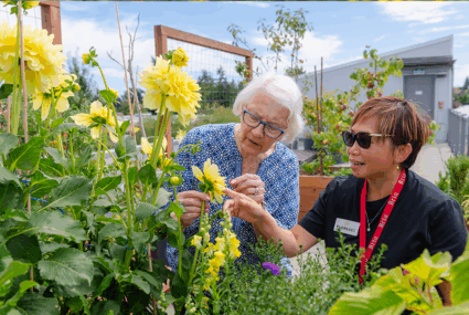 Resident and employee looking at garden