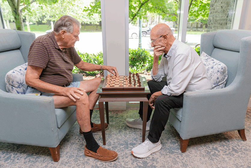 senior men playing chess