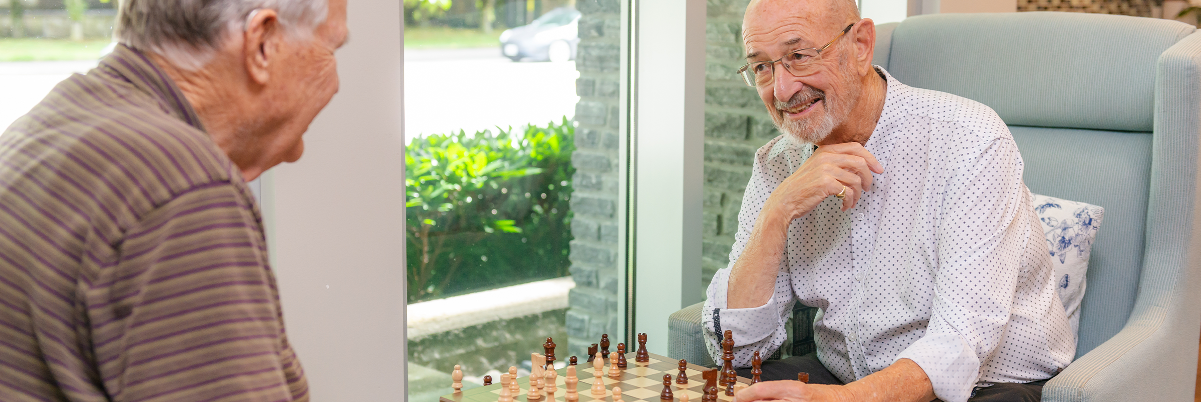 senior man playing ches