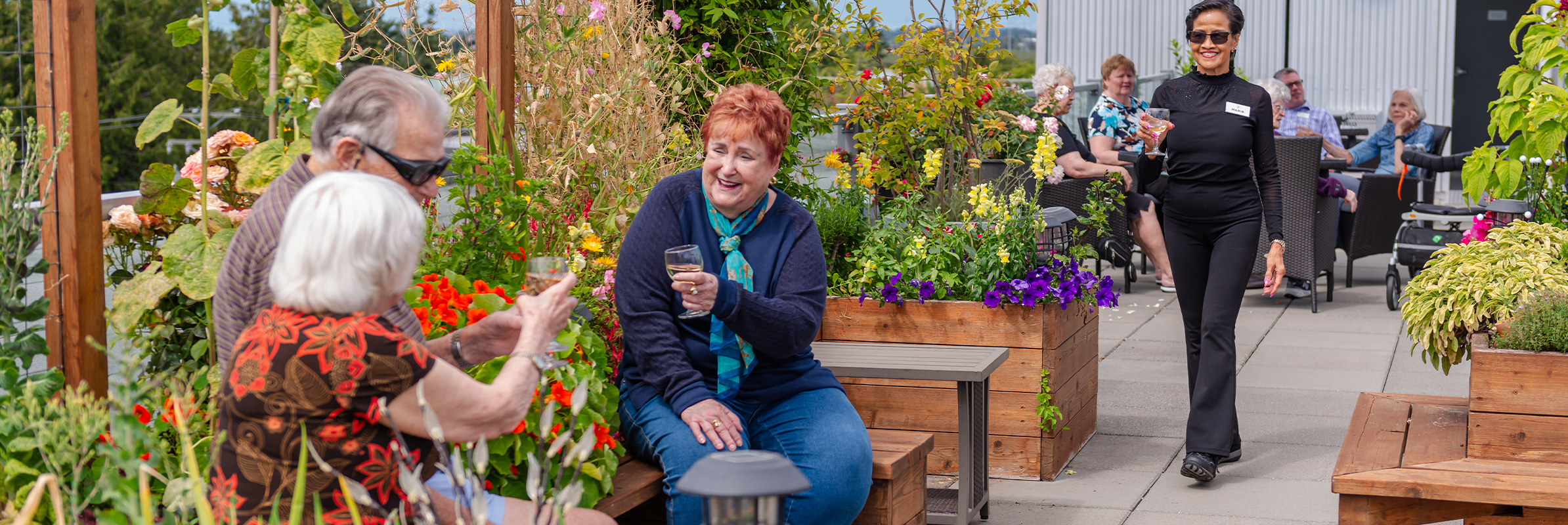 seniors drinking wine on rooftop patio
