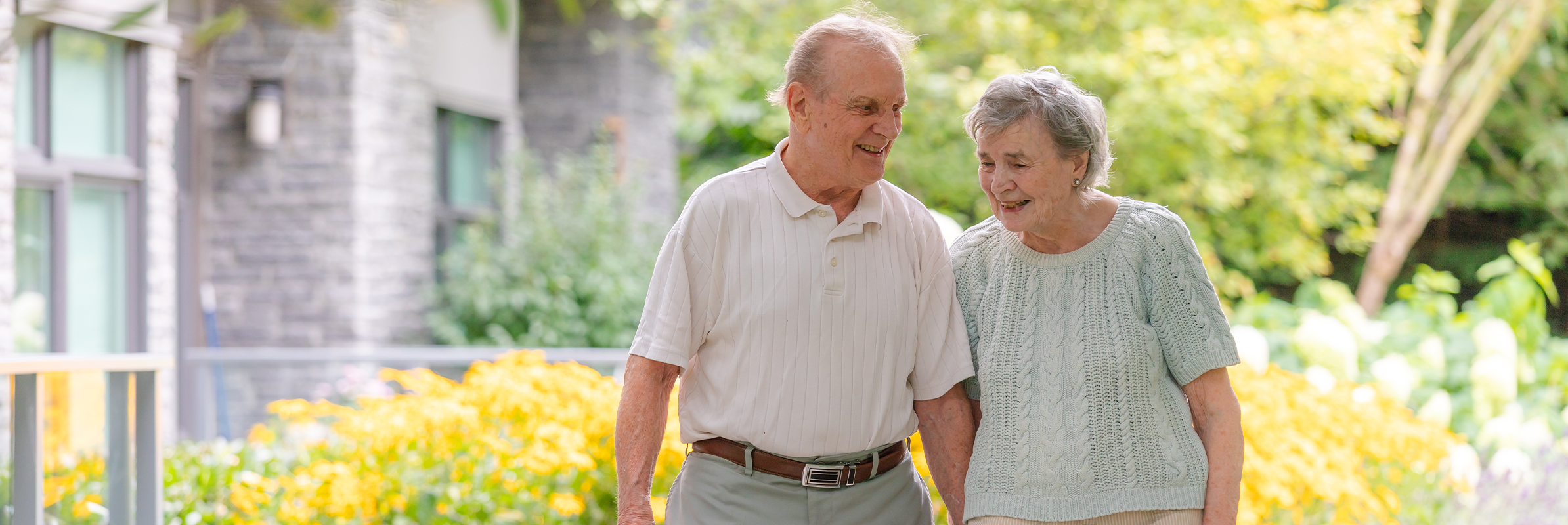 senior couple walking in park