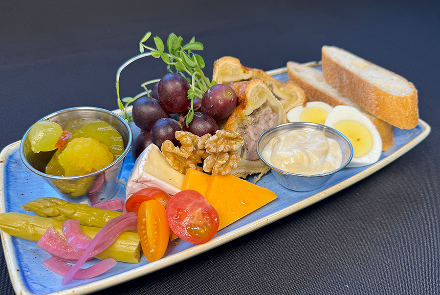 Ploughmans lunch featuring cold pork pie