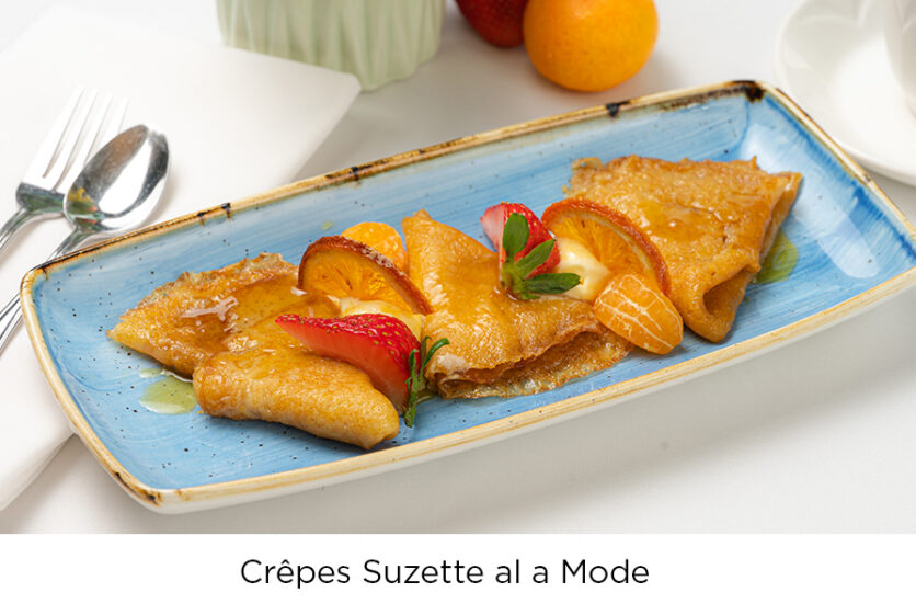 The Wexford Retirement Community Crêpes Suzette al a mode, garnished with orange slices and mint