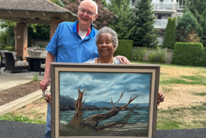 Cindie and Tom residents at Magnolia Gardens Seniors Community in Langley with the painting